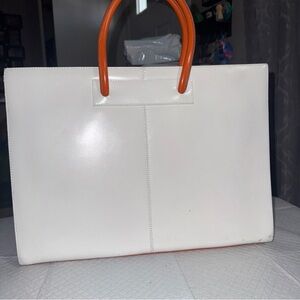 Stylish White Tote with Vibrant Orange Handles